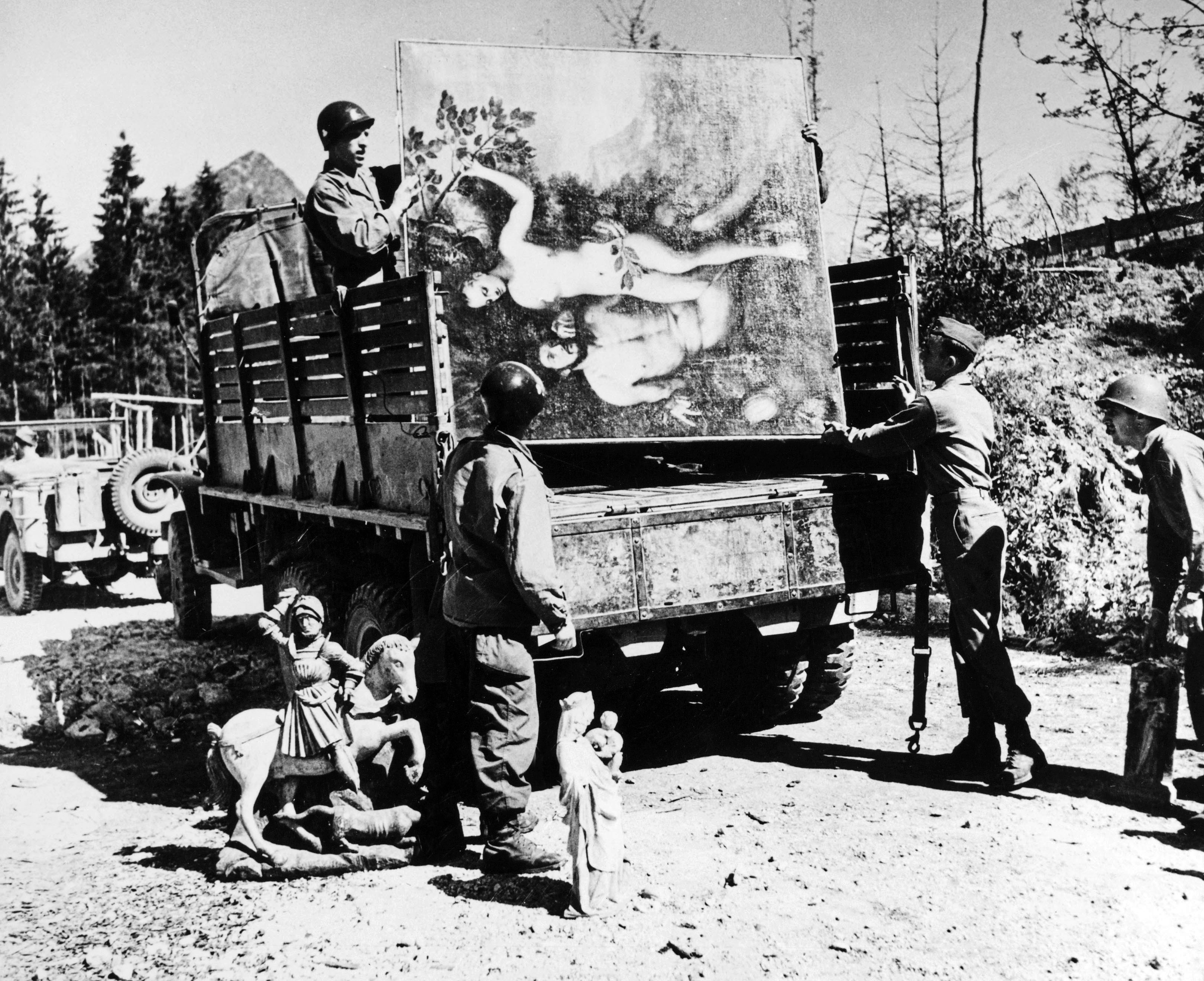 WWII: STOLEN ART, 1945. American soldiers loading works of art stolen by Hermann Goering onto a truck. Photograph, 1945. © Granger NYC / Rue des Archives.